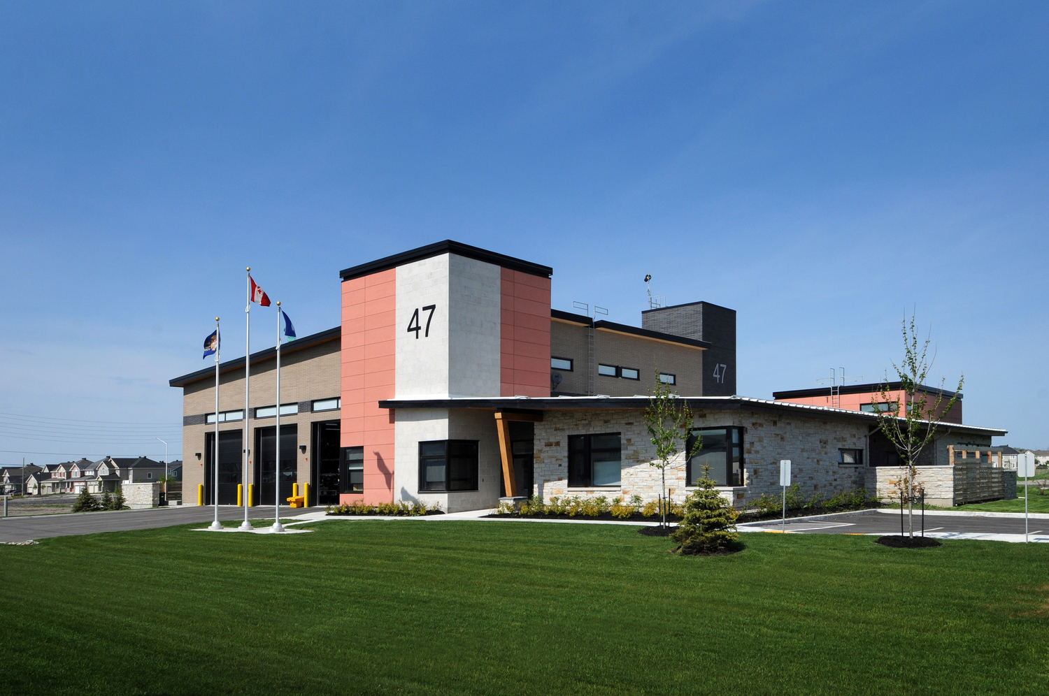 Exterior photo of the recently built Fire Station 47 and its three truck bays.